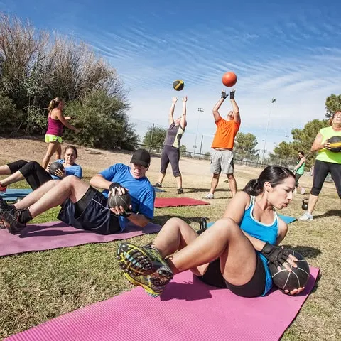Instructor leading an outdoor fitness session